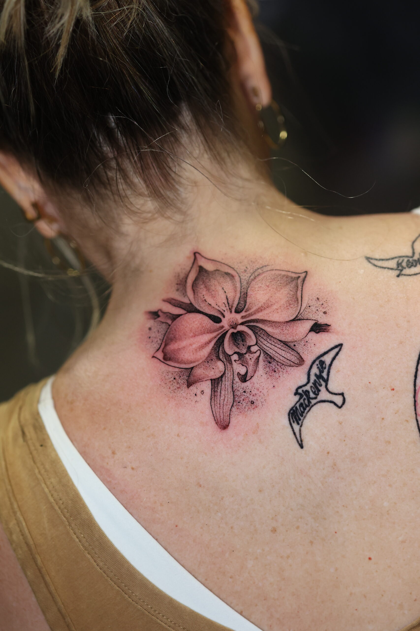 Pangea Ink floral back neck tattoo